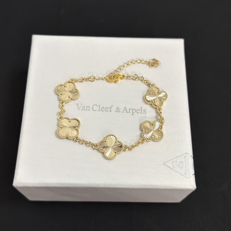 Van Cleef Arpels Alhambra bracelet gold tone metal with guilloche gold clover motifs 19cm