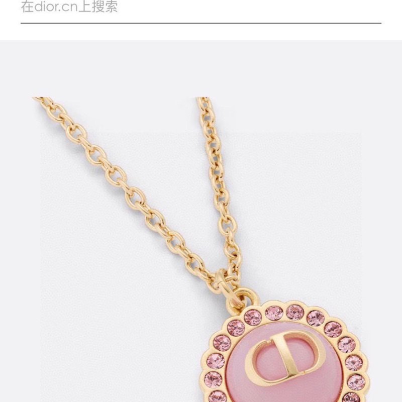 Dior Petit CD necklace Gold-toned metal with black glass center and white resin pearl accents 42cm