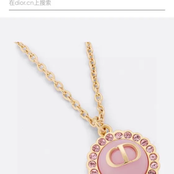 Dior Petit CD necklace Gold-toned metal with black glass center and white resin pearl accents 42cm