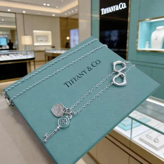Tiffany Co Return to Tiffany Heart Tag with Tiffany Keys Flower Key necklace sterling silver with blue enamel accents 18 inches