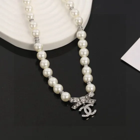 Chanel CC Bow Crystal Pearl Necklace necklace Silver-toned metal white faux pearl clear crystal 42cm with 5cm extender chain
