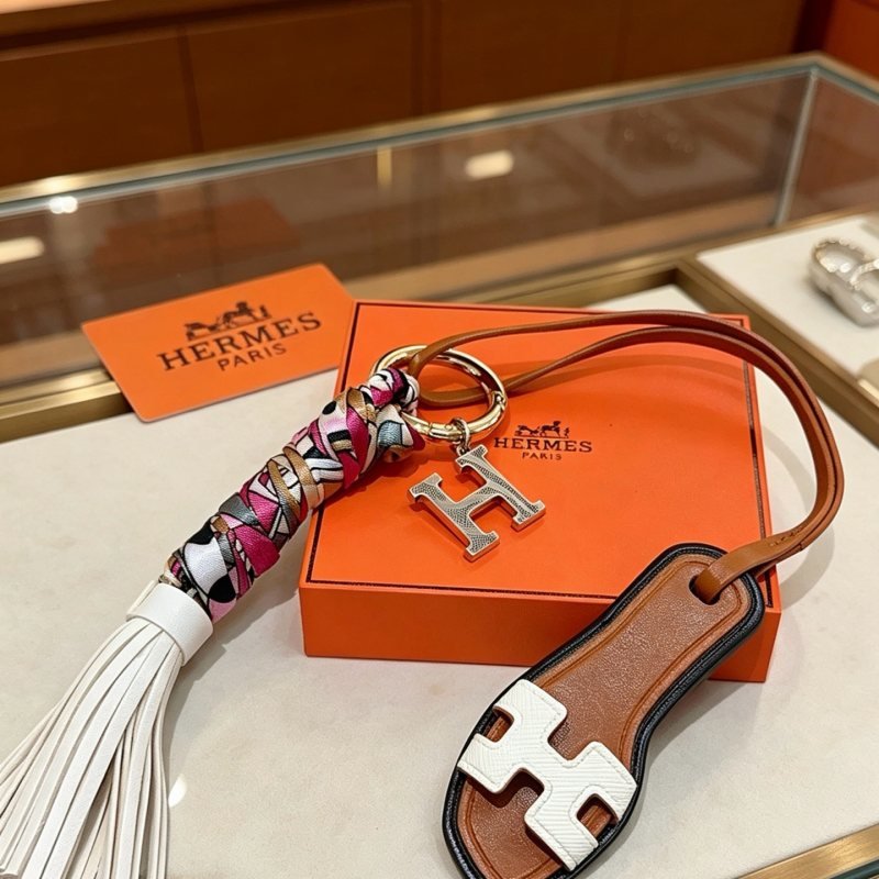 Hermes Oran Sandal Tassel H Charm Keychain pendant Gold-tone metal silver-tone H logo brown leather white leather multicolor pink white black gold silk black trim white leather tassel 12cm total length
