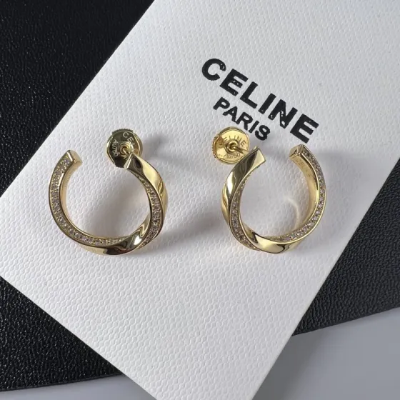 Celine YHED065 Twisted Crystal Hoop Earrings earrings gold-tone metal with clear crystal accents 2 5cm outer hoop diameter