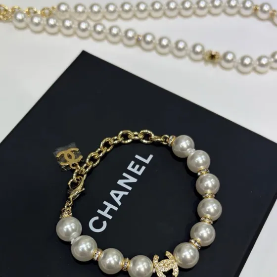 Chanel CC Pearl Crystal bracelet Gold-tone metal cream white faux pearl clear crystal 18cm