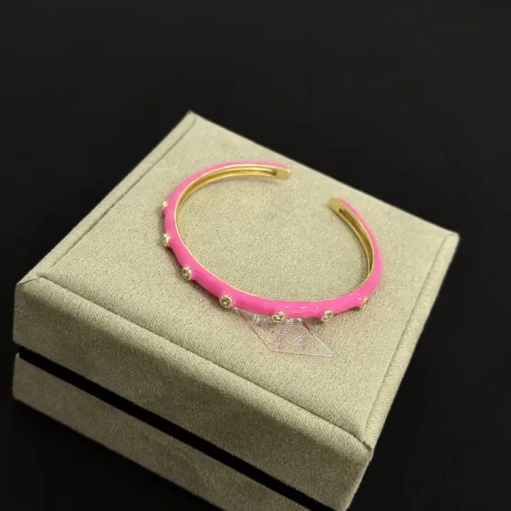 Van Cleef Arpels Alhambra bracelet gold metal hot pink enamel clear diamond accents 17cm