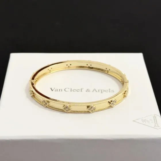 Van Cleef Arpels Perlee Four-Leaf Clover bracelet yellow gold with clear diamond accents 17cm inner circumference