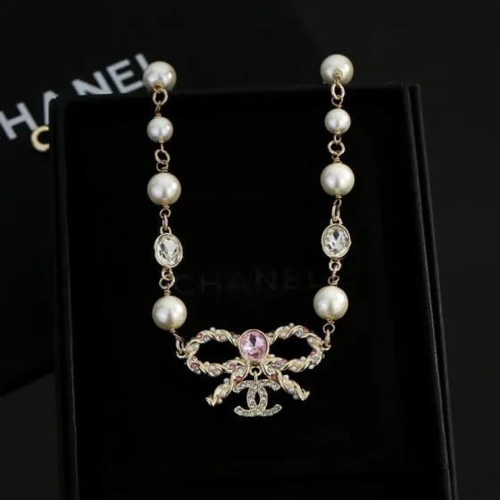 Chanel CC Bow Pearl Crystal Necklace necklace Gold-tone metal cream white faux pearls clear crystals pink center crystal 42cm with 5cm extender