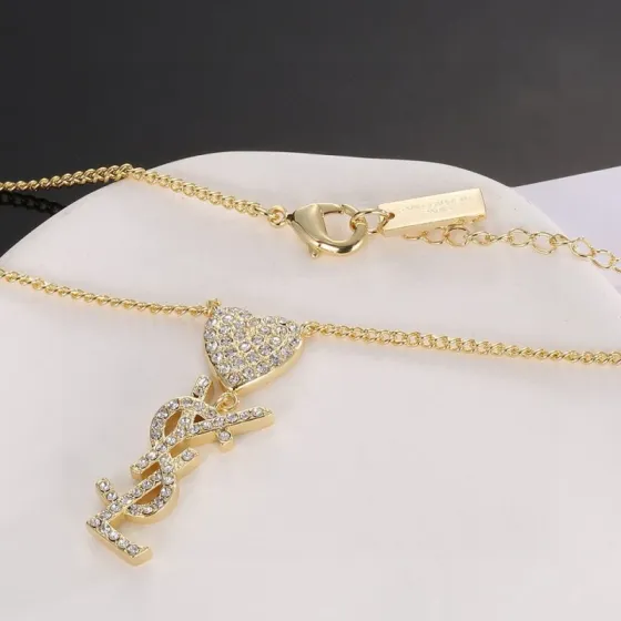 Saint Laurent YSL Monogram Heart Crystal Pendant necklace gold-tone metal with clear crystal accents 45cm with 5cm extender