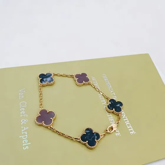 Van Cleef Arpels Vintage Alhambra bracelet Yellow gold with dark blue pietersite and purple rhodonite clover motifs 18cm
