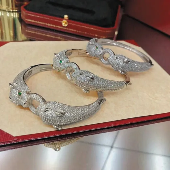 Cartier Panthere de Cartier bracelet 18K white gold pave set diamonds emerald green panther eyes black onyx accents 17cm