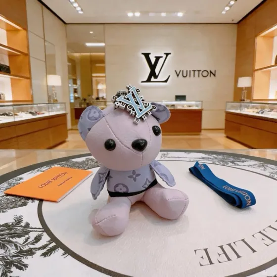 Louis Vuitton Anger Forest Bear Charm pendant Light purple leather with lavender monogram print silver-tone metal with light blue enamel LV logo black plastic eyes and nose black fabric trim blue fabric strap 12cm