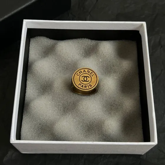 Chanel CC Logo Paris Medallion Signet Ring ring Antique gold-tone metal with black enamel detailing US 7