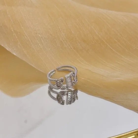 Piaget Possession ring silver-toned white gold with clear diamond accents adjustable open size