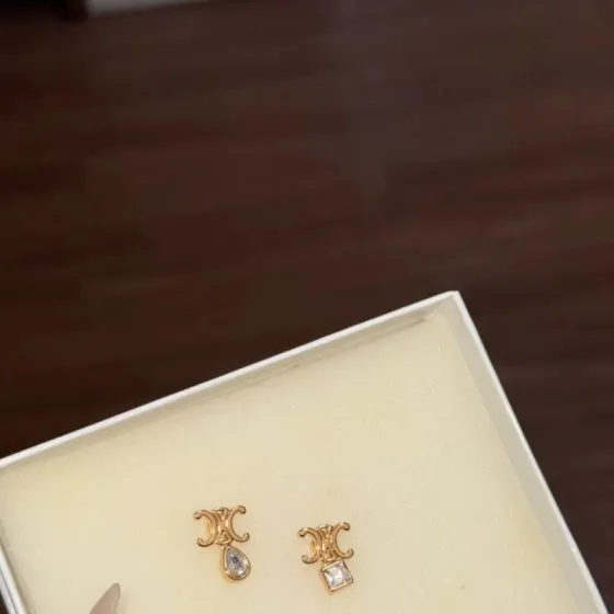 Celine Triomphe Asymmetric Crystal Stud Earrings earrings Gold-tone metal with clear faceted crystals one pear-cut one princess-cut One Size post stud approx 1 2cm drop length
