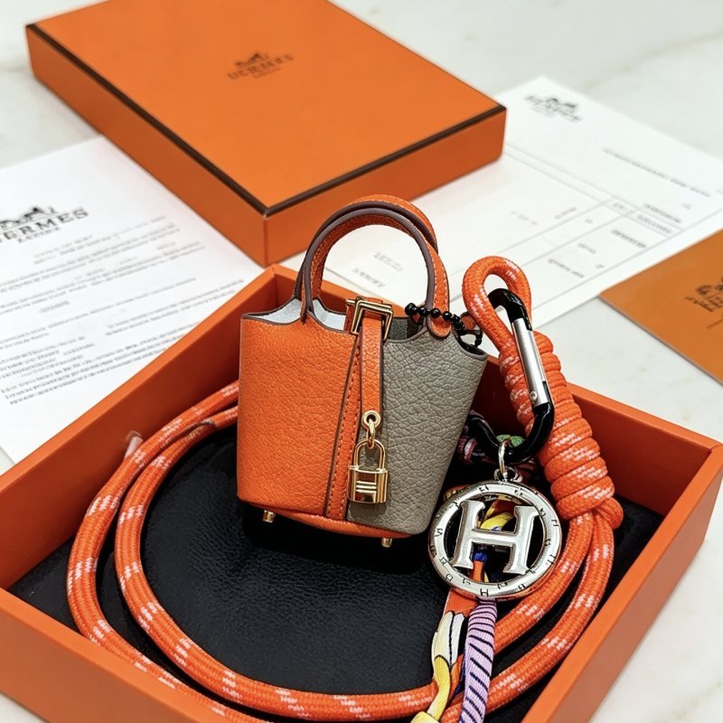 Hermes Mini Picotin Lock Bag Charm pendant Orange and gray leather gold-tone metal hardware silver-tone H logo charm multicolor silk cord accents 80cm
