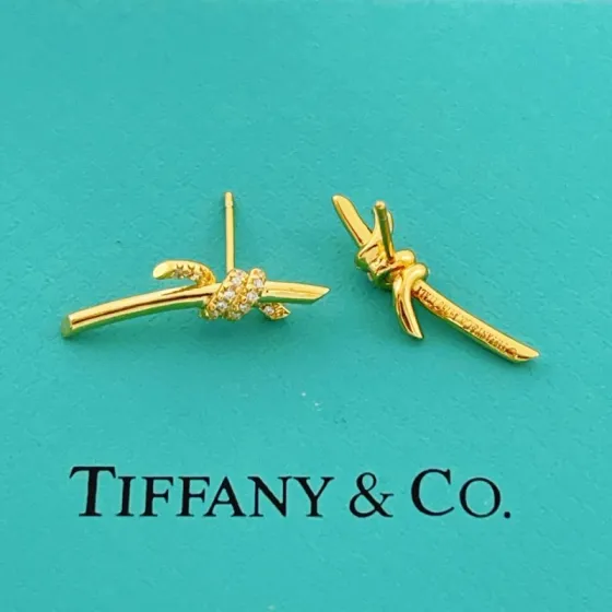 Tiffany Co Tiffany Knot earrings yellow gold with clear diamond accents 18mm bar length