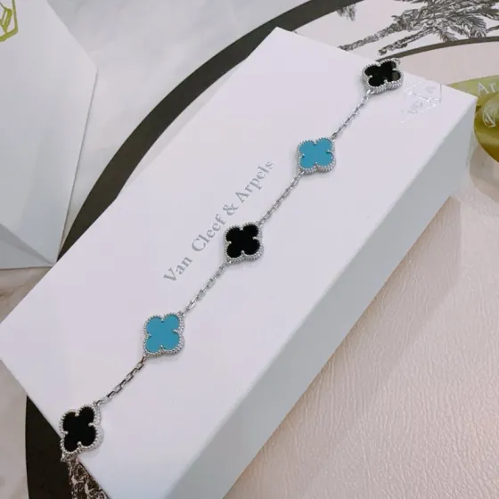 Van Cleef Arpels Alhambra bracelet silver-toned metal with black onyx and turquoise blue clover inlays 17cm