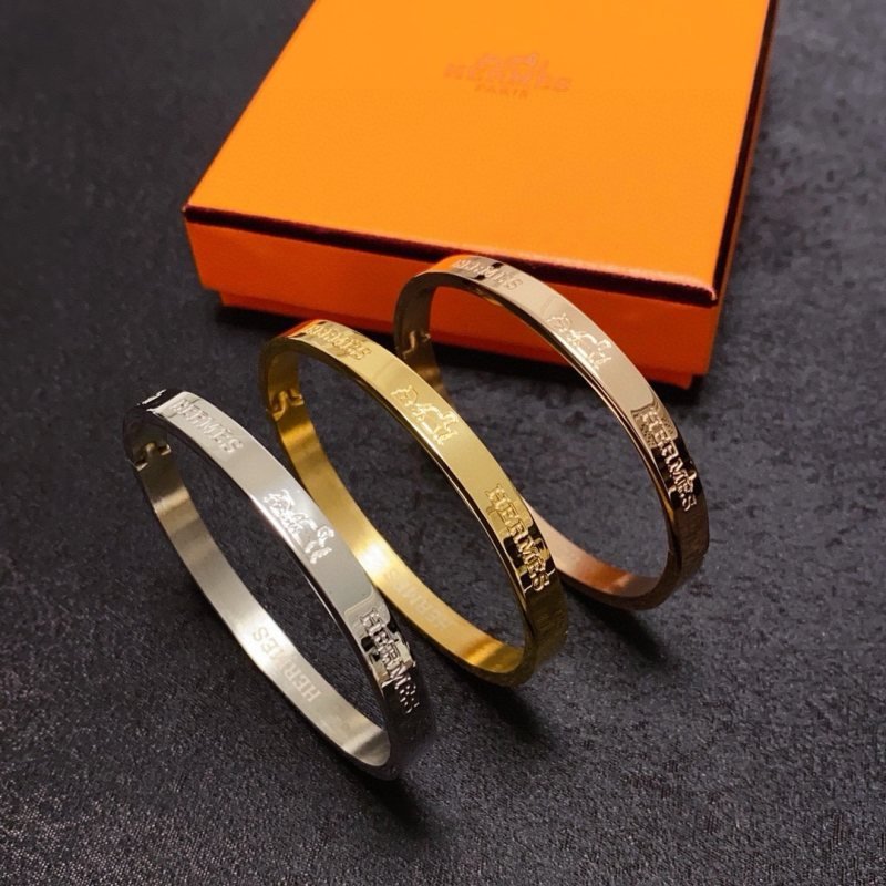 Hermes H d Ancre 14K MM Bangle bracelet Gold-tone metal with engraved Hermes branding no gemstones MM Medium 17cm inner circumference