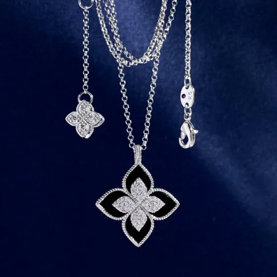 Roberto Coin Princess Flower necklace Sterling silver metal with clear pave diamonds available in black onyx blue turquoise and white mother-of-pearl stone inlays 18 inch adjustable chain