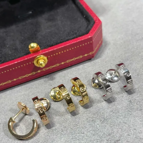 Cartier LOVE earrings 18k yellow gold 18k white gold no gemstones polished plain metal finish narrow version hoop earrings inner diameter approximately 8mm