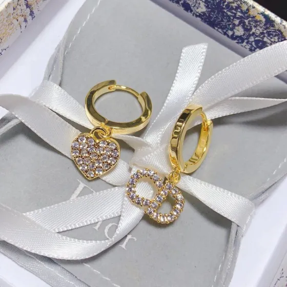 Dior DED0209 Asymmetric Crystal Heart CD Logo Hoop Earrings earrings gold-tone metal with clear faceted crystal accents 12mm hoop diameter 10mm charm drop length