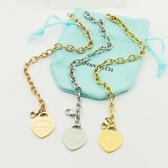 Tiffany Co Return to Tiffany Heart Tag bracelet Gold-tone metal sterling silver rose gold metal with engraved heart tags 7 inches