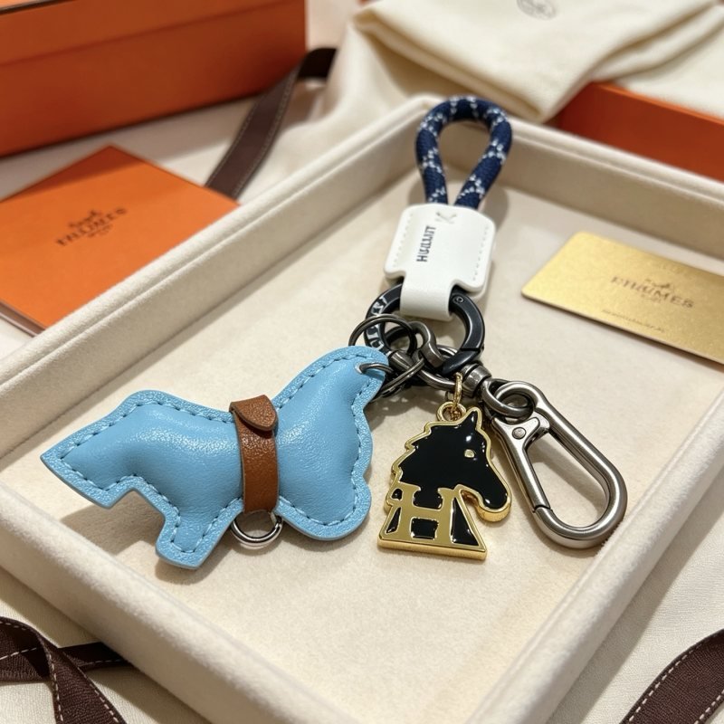 Hermes Cheval Horse Charm Keychain pendant Light blue leather brown leather white leather navy blue braided cord gunmetal hardware silver hardware gold-tone metal with black enamel 10cm total length