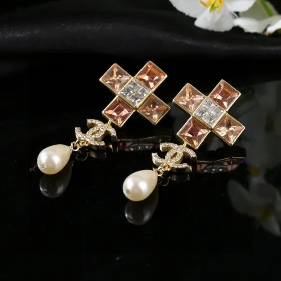 Chanel CC Cross Crystal Pearl Drop Earrings earrings Gold-tone metal with champagne clear crystals cream teardrop faux pearls variant with red crystals also exists 4 5cm drop length