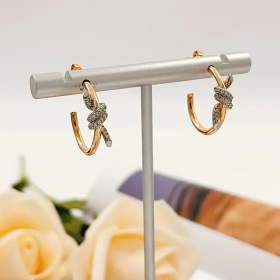 Tiffany Co Knot earrings 18k yellow gold with white diamond pave accents 15mm hoop diameter