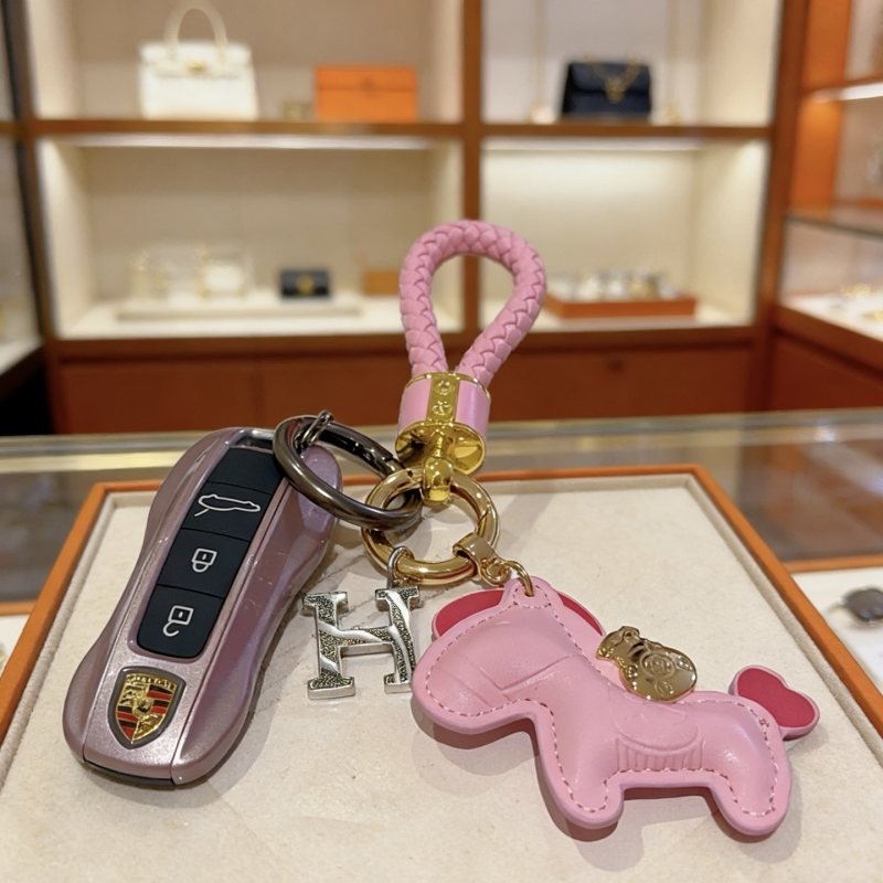 Hermes Rodeo Pony H Charm Keychain pendant Pink braided leather gold-tone metal hardware silver-tone H charm pink leather pony charm with red heart tail detail 10cm total length