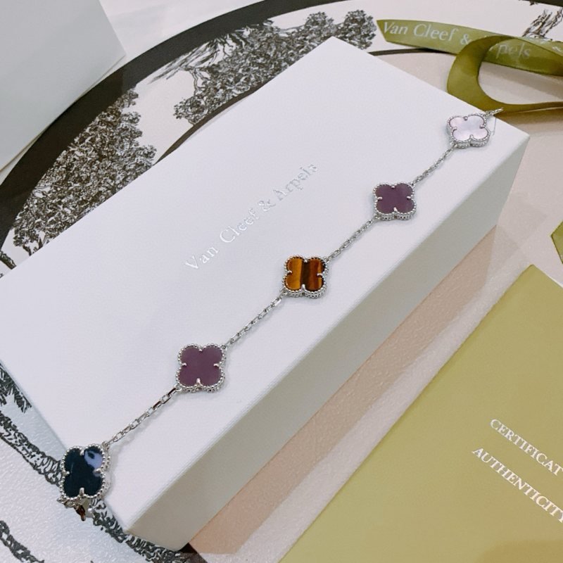 Van Cleef Arpels Alhambra bracelet Silver-toned metal with multicolor clover inlays white mother-of-pearl purple brown tiger s eye dark blue stone 17cm