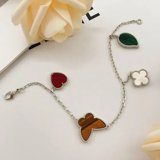 Van Cleef Arpels Lucky Alhambra bracelet Silver-toned metal with red carnelian green malachite brown tiger s eye and white mother-of-pearl 19cm