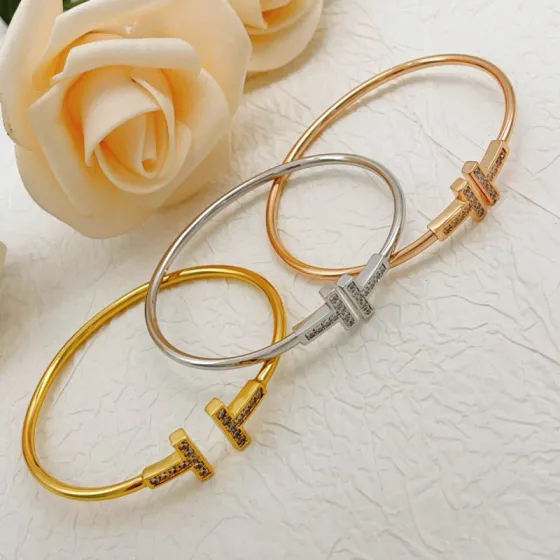 Tiffany T Wire bracelet 18k rose gold with clear diamond accents 18k yellow gold with clear diamond accents sterling silver with clear diamond accents 17cm inner circumference