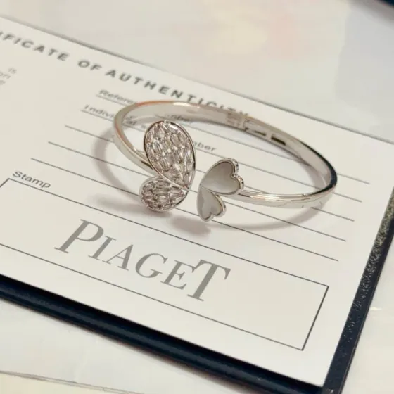 Piaget Butterfly Heart Open Bangle bracelet Silver-toned white gold metal clear baguette-cut diamonds white mother-of-pearl 16cm inner circumference