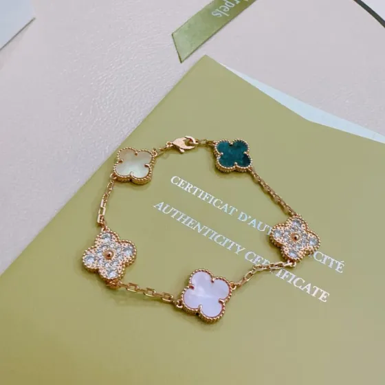 Van Cleef Arpels Alhambra bracelet Rose gold metal with white mother-of-pearl teal agate champagne mother-of-pearl opal and clear diamond accents 17cm