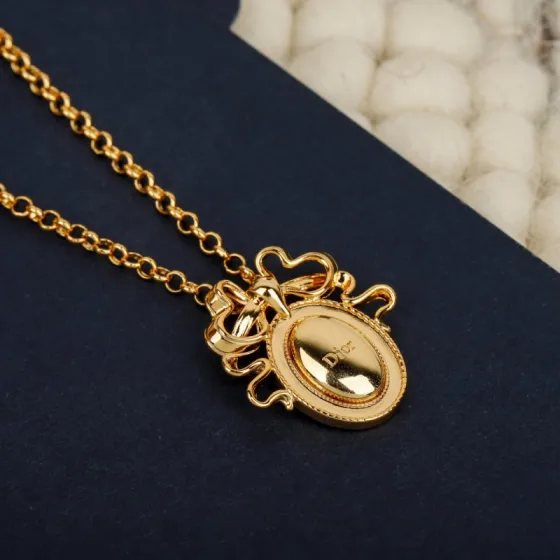 Dior 2021 New Year Bow Oval Pendant bracelet gold-tone metal no accent stones 18cm with 3cm extender