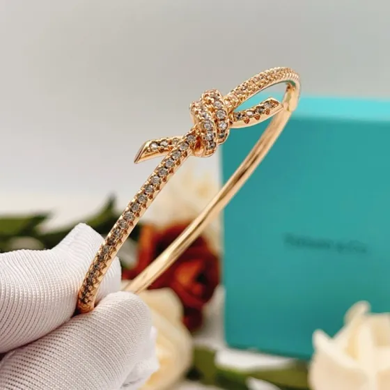 Tiffany Co Tiffany Knot bracelet 18k rose gold with pave set clear diamonds 17cm inner circumference