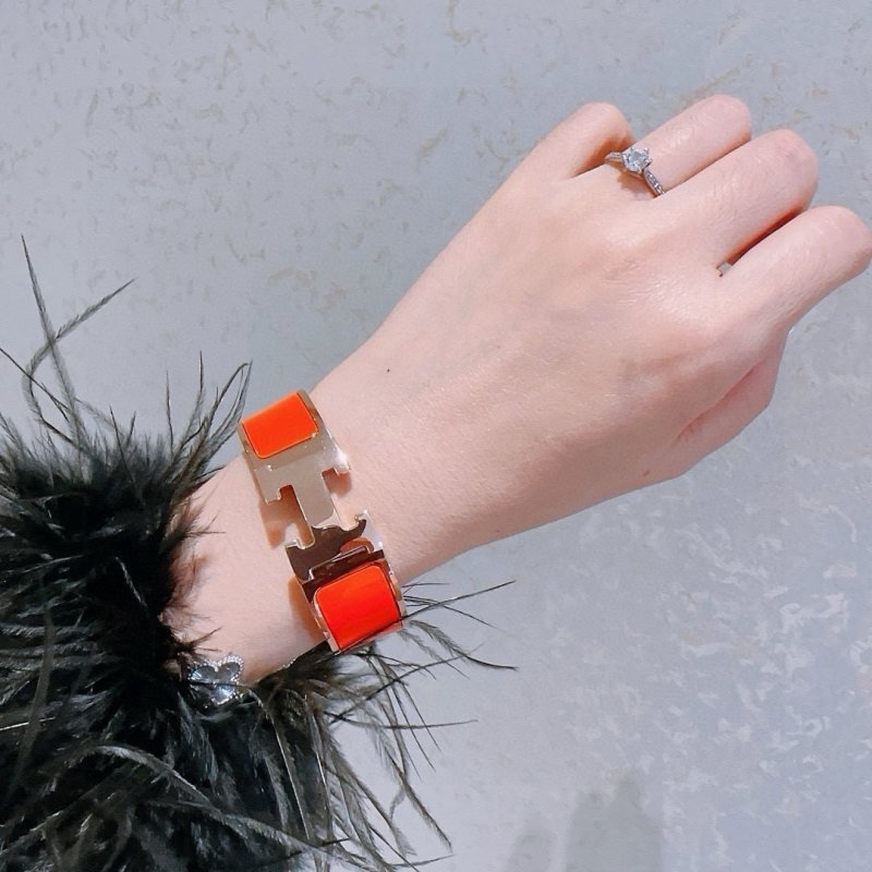 Hermes Clic Clac H bracelet gold-tone metal with bright orange enamel 18mm