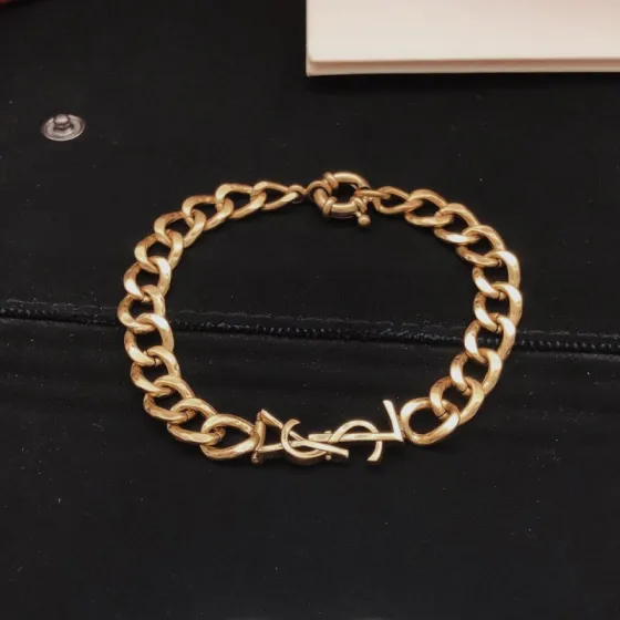 Saint Laurent Cassandre YSL Logo Curb Chain bracelet vintage gold tone metal no accent stones 19cm