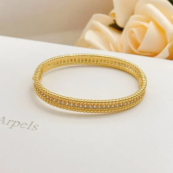 Van Cleef Arpels Perlee bracelet Yellow gold metal with clear diamond accents 17cm inner circumference