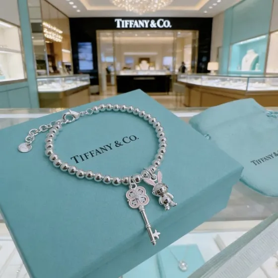 Tiffany Co Return to Tiffany Bead Charm Bracelet bracelet Silver metal with pink enamel and clear stone accents 17cm