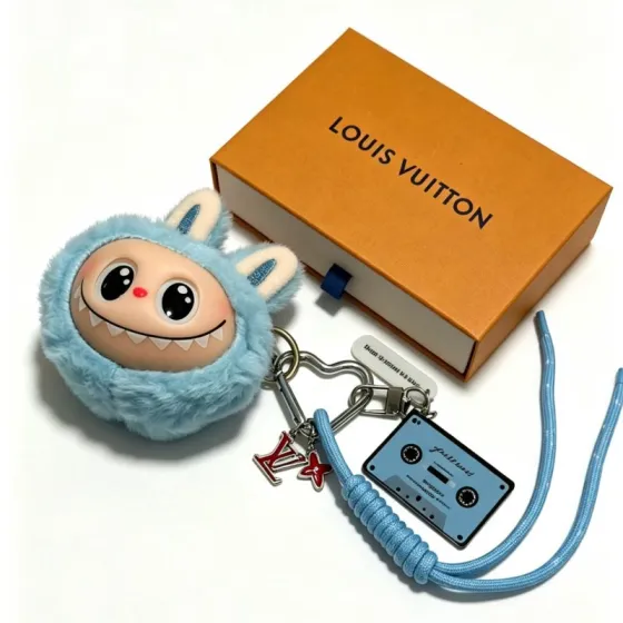 Louis Vuitton Anger Forest Labubu Cassette Charm Keychain pendant light blue plush silver-tone metal red enamel light blue cord black cassette detailing beige plush ear accents 20cm lanyard length