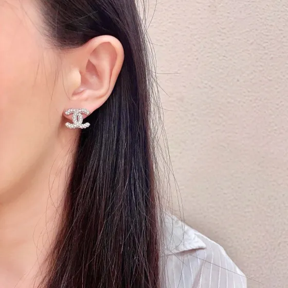Chanel CC Logo Stud Earrings earrings silver-tone metal with clear crystal and white pearl embellishments 1 2cm diameter per earring