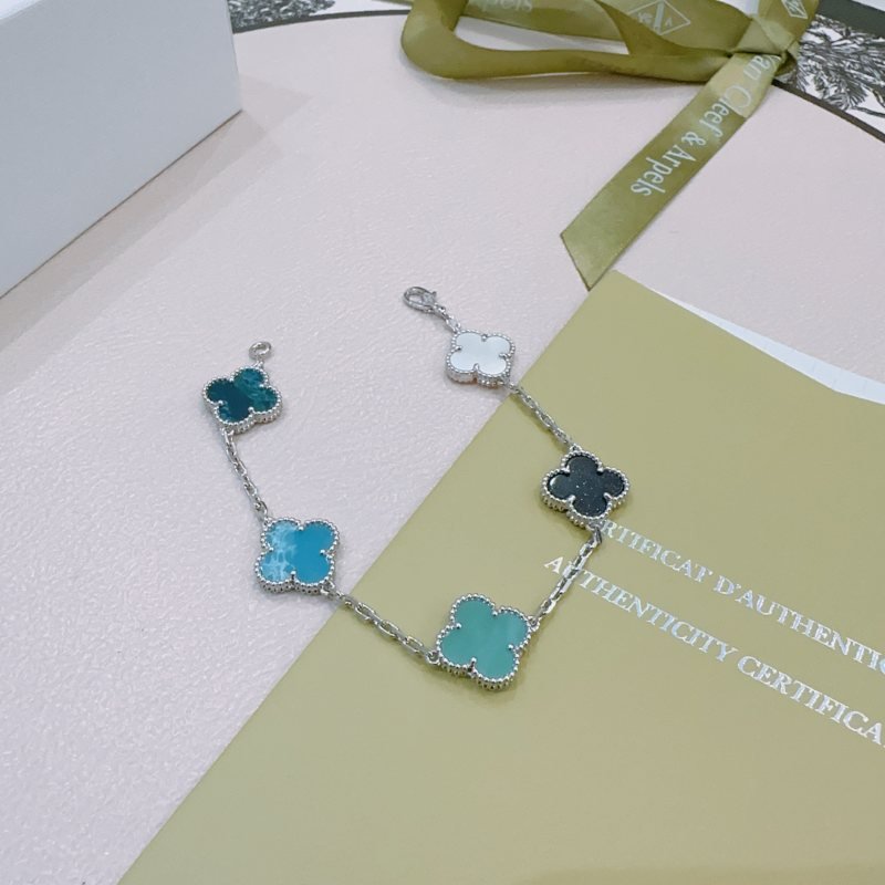 Van Cleef Arpels Alhambra bracelet Silver-toned metal with white mother-of-pearl black onyx turquoise blue agate and dark teal chalcedony clover motifs 17cm
