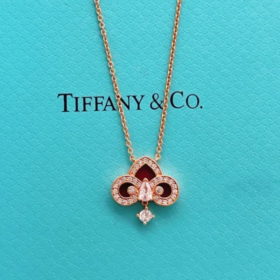 Tiffany Co Fleur de Lis Key Pendant Necklace necklace Rose gold metal with red carnelian inlay and clear diamond accents 45cm