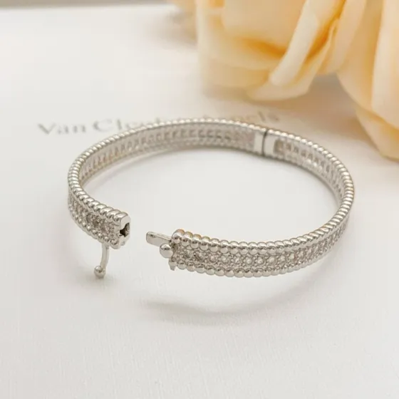 Van Cleef Arpels Perlee bracelet silver-toned metal with clear diamond-like stones also available in yellow gold-toned and rose gold-toned metal variants with clear stones 17cm