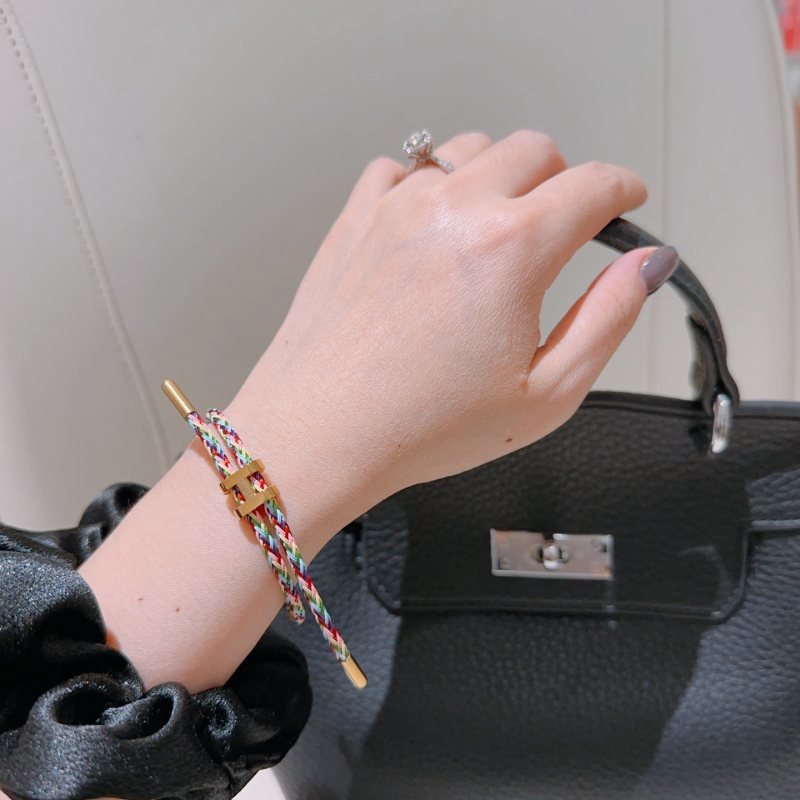 Hermes H d Ancre bracelet gold-tone metal with multicolor rainbow braided cord adjustable sliding knot fits 15-18cm wrist
