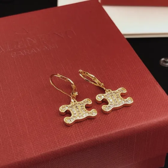 Celine Triomphe earrings gold-tone metal with clear crystal accents 1 5cm drop