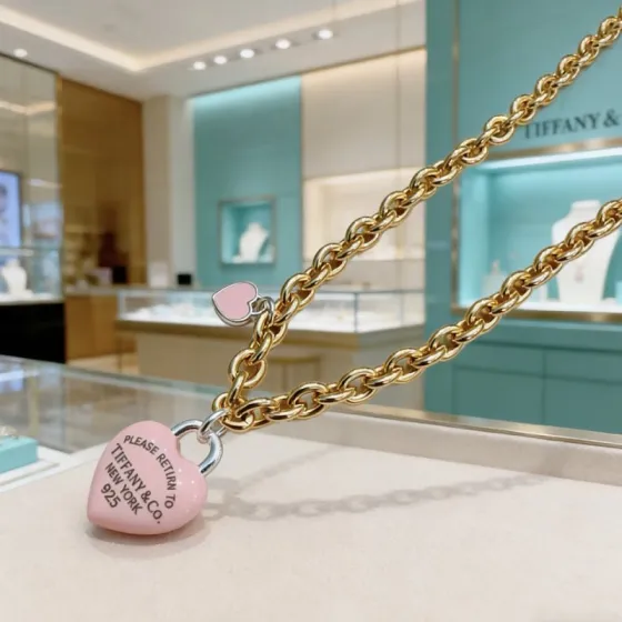 Tiffany Co Return to Tiffany Pink Heart Tag necklace gold-tone metal with pink enamel heart charms and silver-tone hardware 18 inches