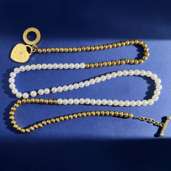Tiffany Co Return to Tiffany Heart Tag necklace gold-tone metal white pearl clear diamond accent 18 inches